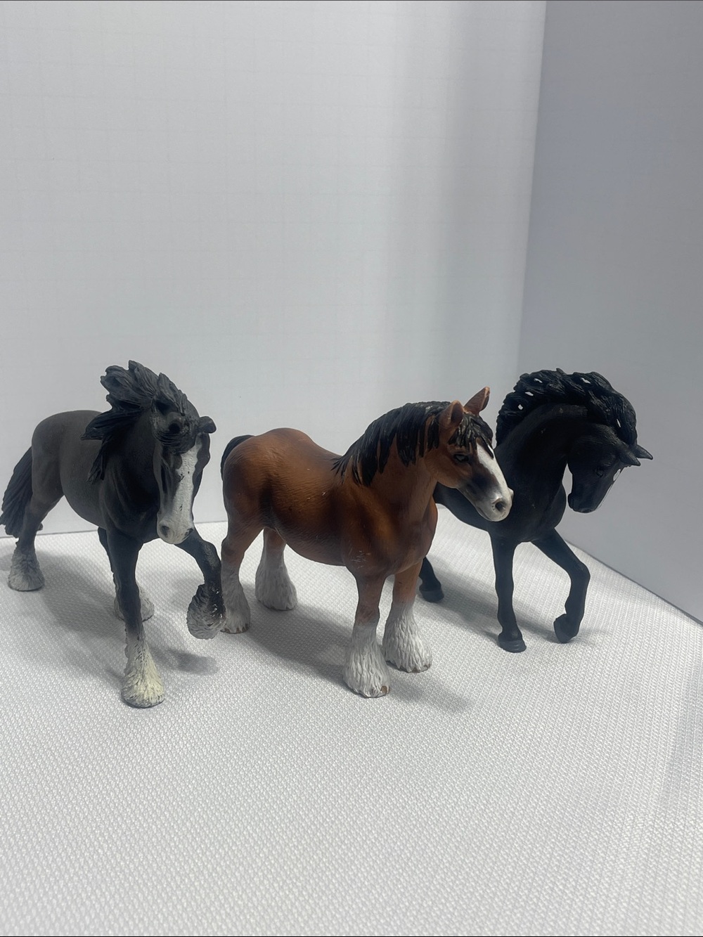 Three Schleich Horses. Black brown. 1 Clydesdale. Preowned. Scratches.